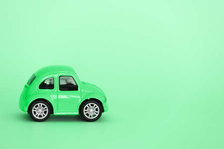 cute green car isolated on a green background copy spaceの写真素材