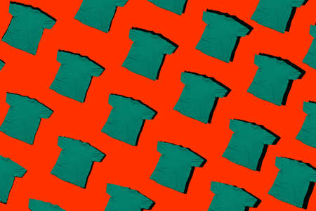 green t shirts pattern isolated on a red background