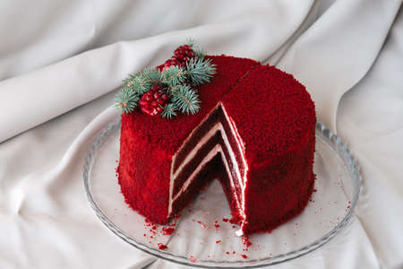 red velvet cake decorated on a plate textile backgroundの写真素材