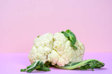 fresh organic cauliflower on a pink background copy spaceの写真素材