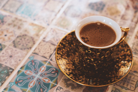 Close-up Turkish strong coffee cup on a blurred background oriental tiles.の写真素材