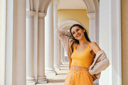 Emotional portrait of caucasian brunette woman in casual clothes. Travel concept.の写真素材