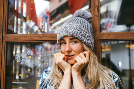 Cute young hipster woman winter portrait. Lifestyle Christmas vibes portrait.の写真素材