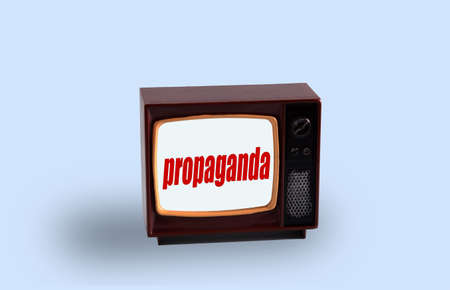 Vintage tv with inscription propaganda on blue background.