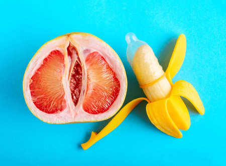 Top view citrus and banana in condom on blue background.の写真素材