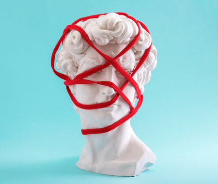 David's head wrapped in red thread on blue background.