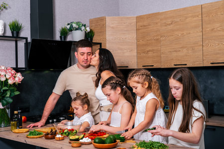 family cooking togetherの写真素材