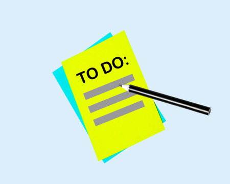 To do list note and pencil on blue background.の写真素材