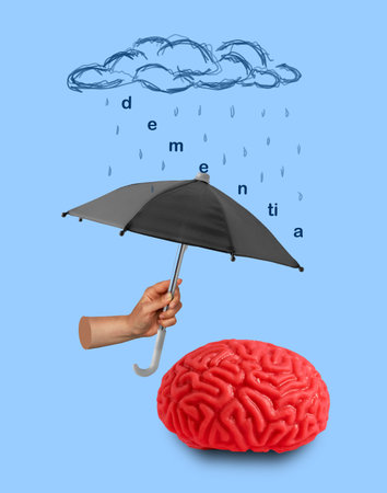 Hand holds umbrella and protects human brain from dementia. Creative art concept.の写真素材