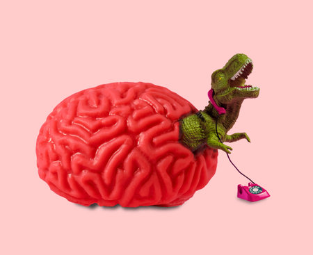 Human brain from which dinosaur climbs out talking on retro phone. Mental health problems concept collage.の写真素材