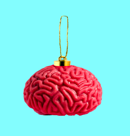 Human brain Christmas tree toy on blue background. Creative collage.の写真素材