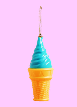 Blue ice cream Christmas tree toy on pink background. Creative collage.の写真素材