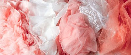 Top view abstract background of crumpled pink and white chiffon.の写真素材
