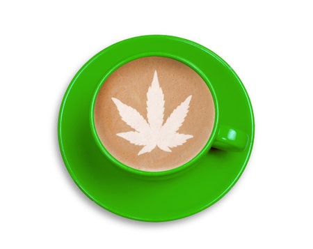 Top view green cup with coffee with latte art of cannabis leaf isolated on white background.の写真素材