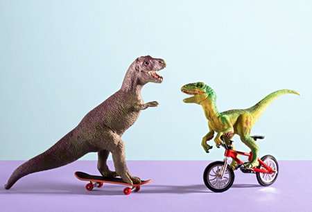Two happy cute dinosaurs on bike and skate on blue and violet background.の写真素材