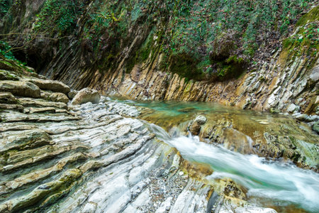 Beautiful landscape with the Kuapse River and rocky shoresの写真素材