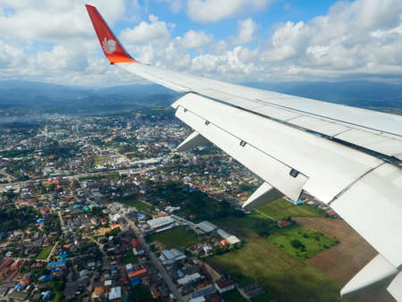 Chiang Rai, Thailand - NOVEMBER 12 2020: A Thai Lion Air plane prepares to land.のeditorial素材