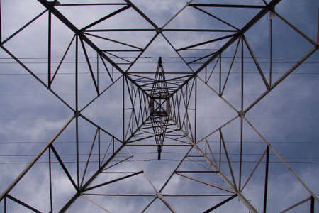 Power line tower with blue skyの写真素材