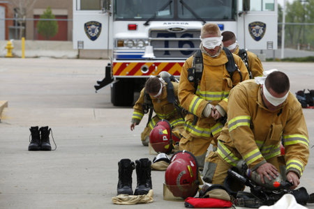 Arvada Fire Department cadets going through drills and exercises at the training faculty in the burn house and other courses. On 05/14/2011 in Arvada, Colorado, USA.のeditorial素材