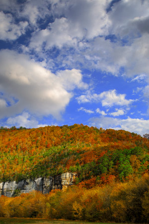 Sunset photo during the autumn as the trees change color at Roark Bluff in Steel Creek Campground along the Buffalo River located in the Ozark Mountains, Arkansas.の写真素材