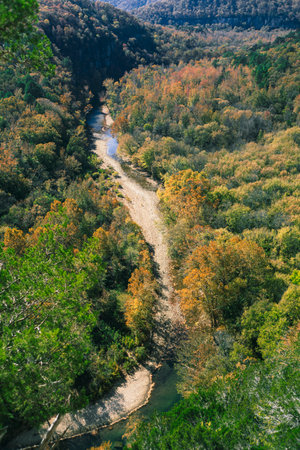 A scenic view of trees changing color and the Buffalo River in the Ozark Mountains from the Big...