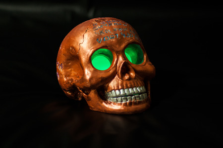 Magic skull with glowing green eyesの写真素材