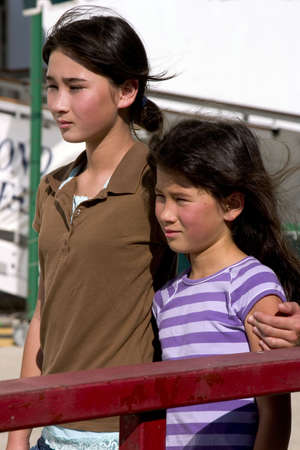Sisters standing together