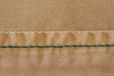 close-up of seams on jacket with wrinkle effect. canvas fabric texture