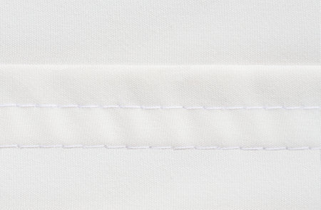 Twin needle stitching background on white thread and material