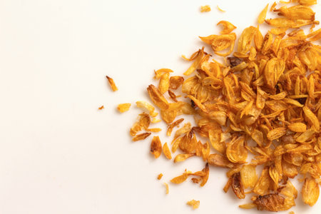 Crispy fried onion on white background with copy space for textの写真素材