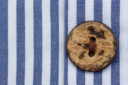 Close up of natural shirt buttons made from coconut shellsの写真素材