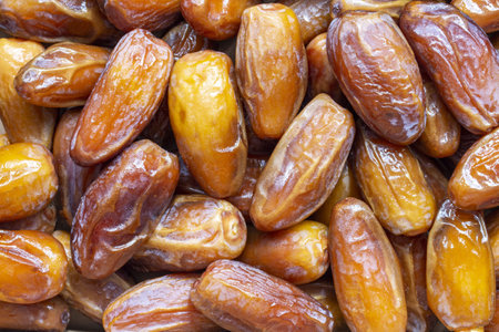 Dates fruit close up background. Top view of dried dates fruits.