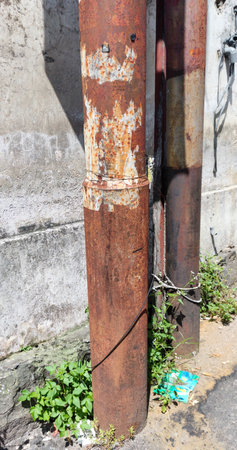 rusty electric poleの写真素材