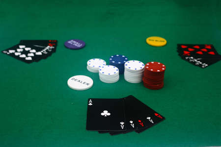 A game of poker on the basic green cloth.