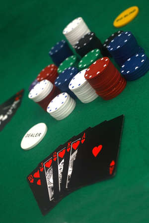 A game of poker on the basic green cloth.