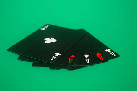 A great hand in a poker game with a green background.の写真素材