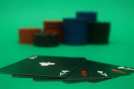 A great hand in a poker game with a green background.の写真素材