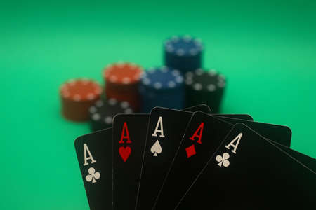 A great hand in a poker game with a green background.の写真素材