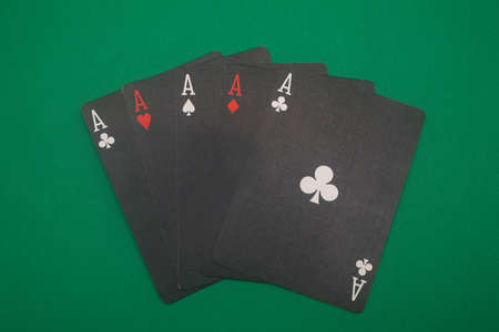 A great hand in a poker game with a green background.の写真素材