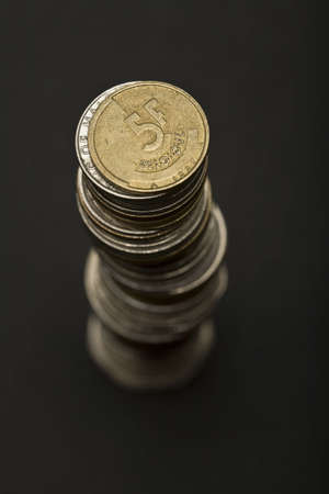 Loads of coins from around the world, isolated.
