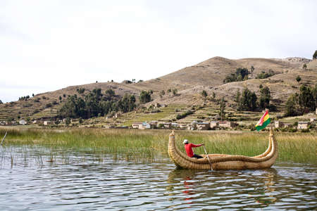The Uros, an indigenous people predating the Incas, live on Lake Titicaca upon floating islands fashioned from this plant. The Uros also use the Totora plant to make boats (balsas) of the bundled dried plant reeds.の写真素材