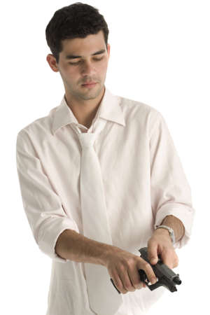 A 20 year old latino business man with a gun and light pink shirt, isolated on a white background.の写真素材