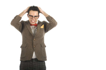 A young, caucasian nerd, worried, isolated on a white background.の写真素材