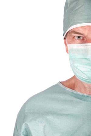 A 60 year old surgeon isolated on a white background.の写真素材
