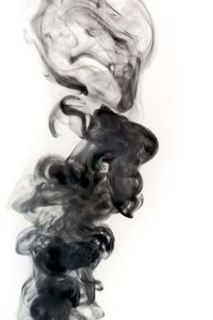 A photograph of black smoke on a white background. の写真素材