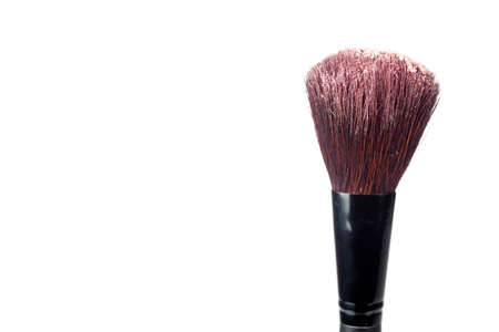 A blush brush with powder isolated on a white background.の写真素材