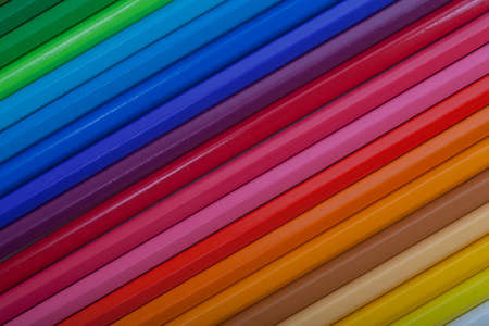 A vivid image with various colored pencils such as yellow, orange, red, pink and blue.の写真素材
