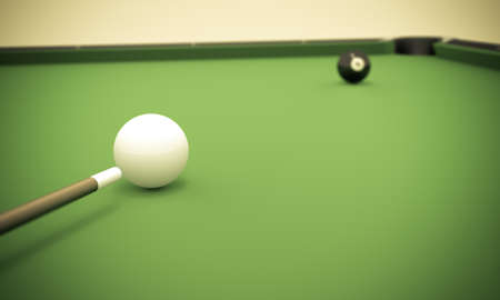 A white ball in the center of a pool table aiming at the 8 ball near the corner pocket.の写真素材