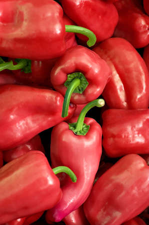 Organic red peppers at the farmers' marketの写真素材