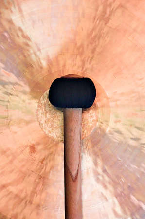 Large copper gong and malletの写真素材